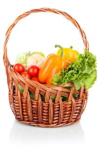 Fresh vegetables including tomatoes, peppers, and lettuce in a basket for Bhog.