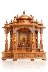 Beautiful handcrafted wooden temple with intricate carvings for spiritual rituals.