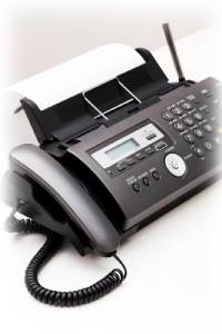 Modern office landline phone with digital display and keypad.